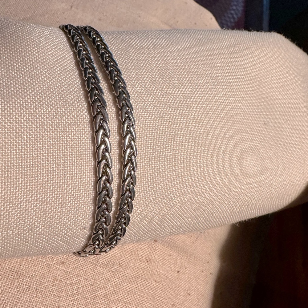 Silver metal braided bracelet. Brighton look and style.lobster claw clasp